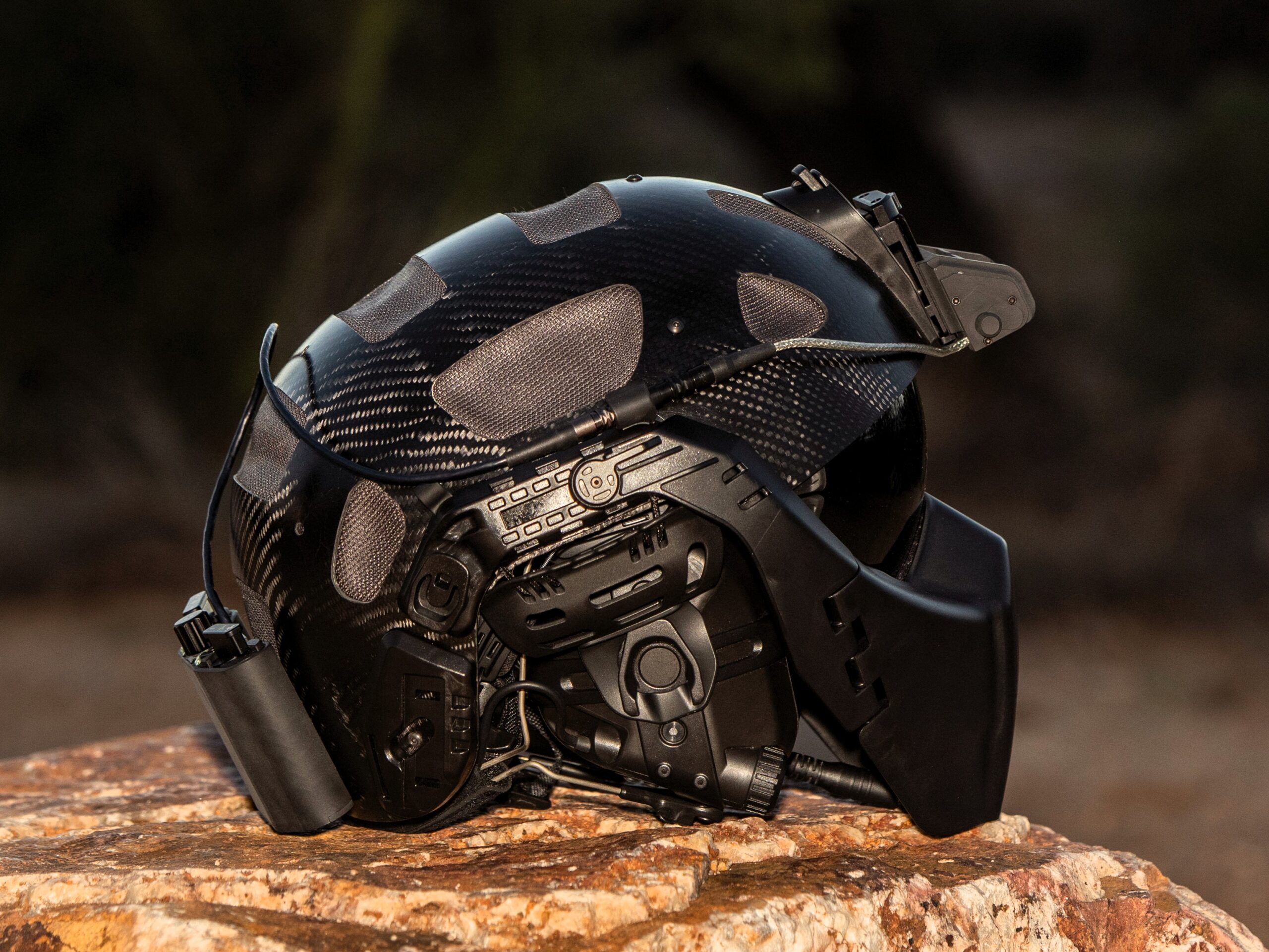 RATH rotary-wing tactical helmet side view showing carbon fiber shell and communications system